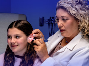 Happy child receiving treatment from a physician.