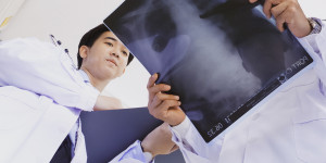 Image of clinicians reviewing X-ray.